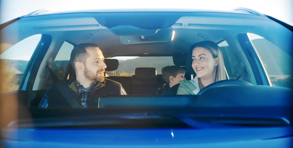 Family driving with Blue Car Rental