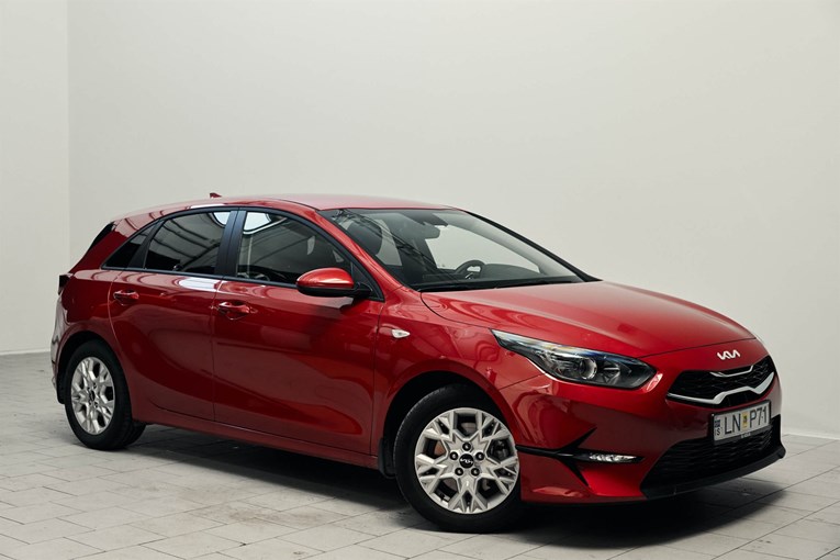 Red Kia Ceed economy rental car.