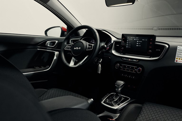Kia Ceed interior featuring a automatic transmission shift steering wheel and infotainment  system.