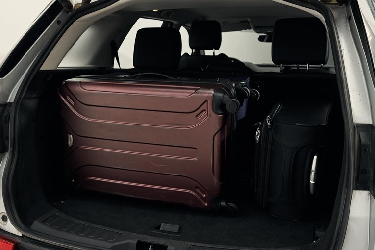 Land Rover Discovery Sport open trunk with luggage. 