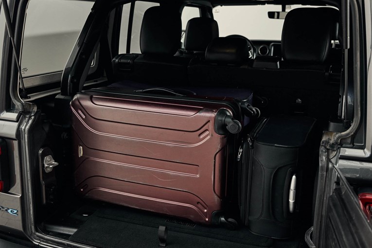 Jeep Wrangler Rubicon open trunk with luggage. 