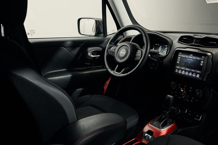 Jeep Renegade interior featuring a steering wheel and infotainment system.