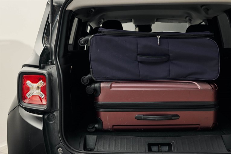 Jeep Renegade open trunk with luggage.