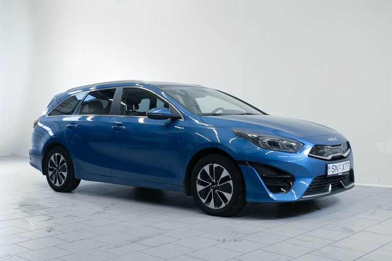 Blue Kia Ceed Sportswagon rental car.