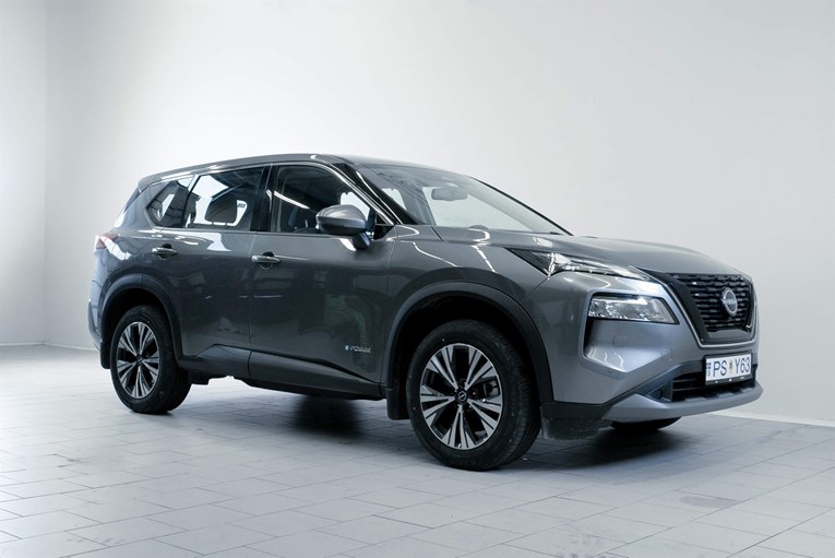 Grey color Nissan X-Trail 7 seat rental car SUV.